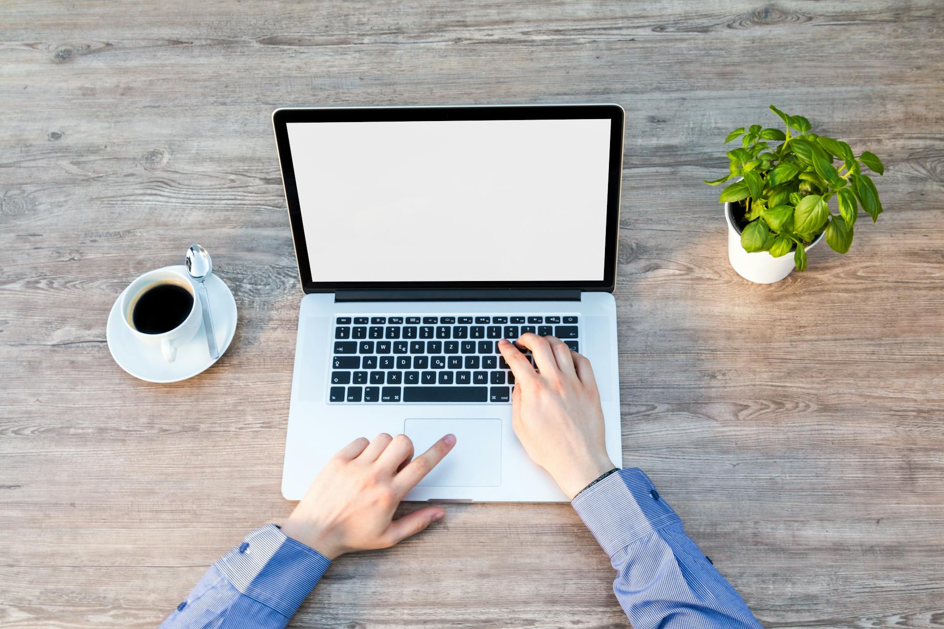 Person's Hand on Laptop