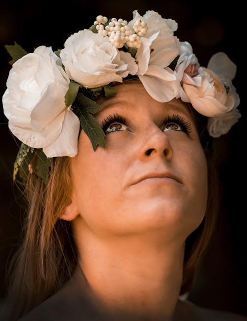 Dreamy woman with flower wreath on head