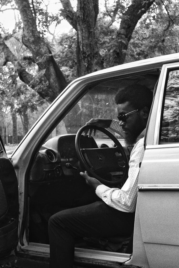 Bearded Black Male Driver In Old Fashioned Car