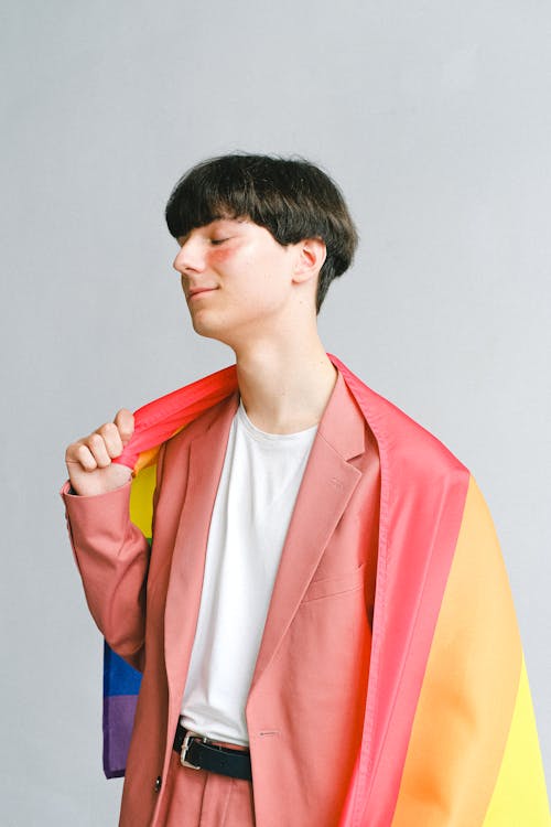 Young Man Holding a Gay Pride Flag