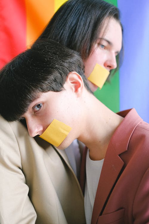 Free Two Men With Adhesive Tape Over Their Mouth Stock Photo