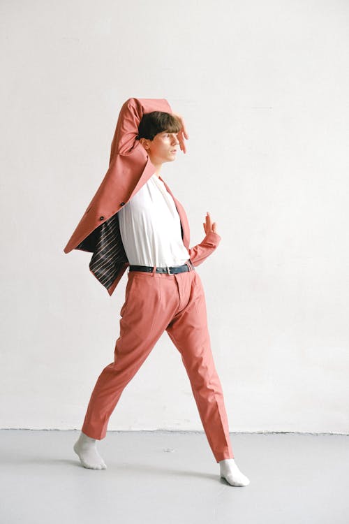 Free Man in Pink Suit Doing Dance Moves Stock Photo