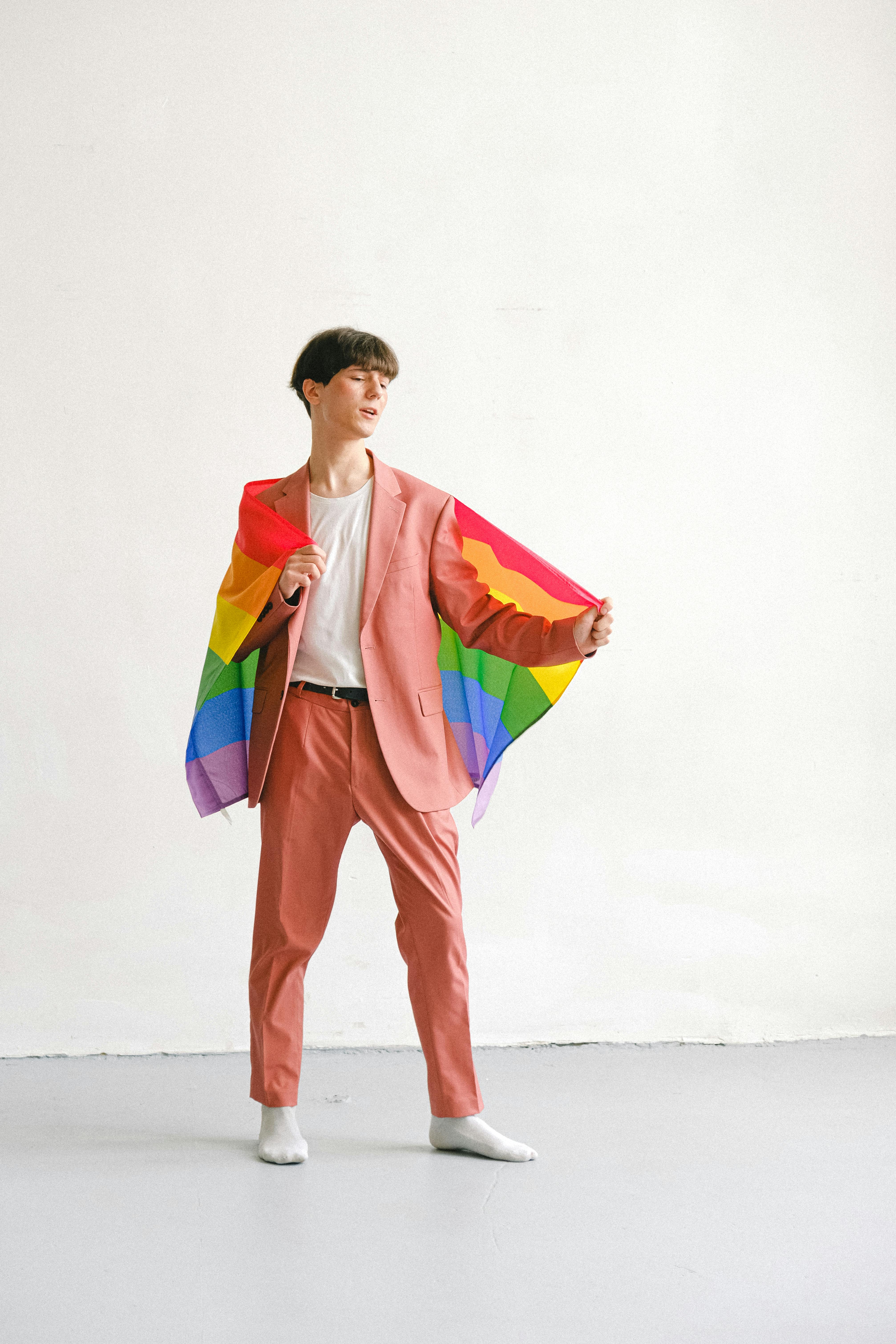 man holding a gay pride flag