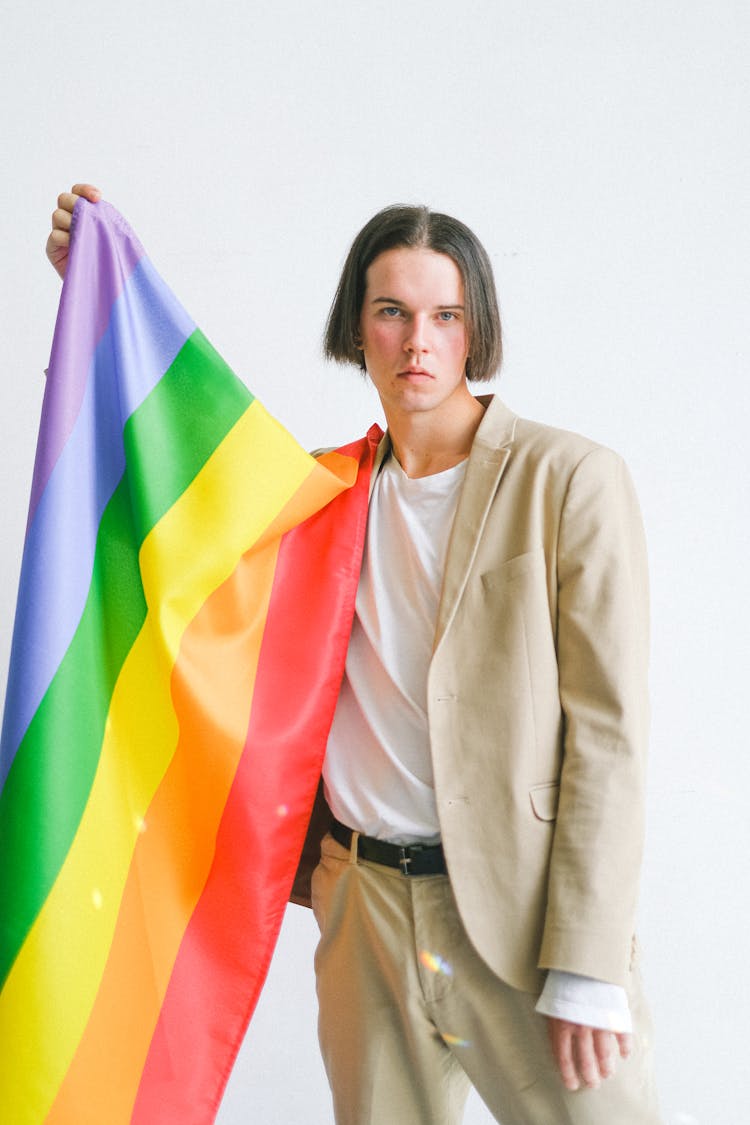 Man Holding A Gay Pride Flag