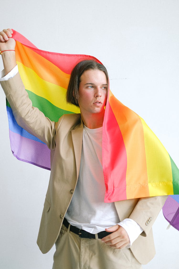 Man Holding A Gay Pride Flag