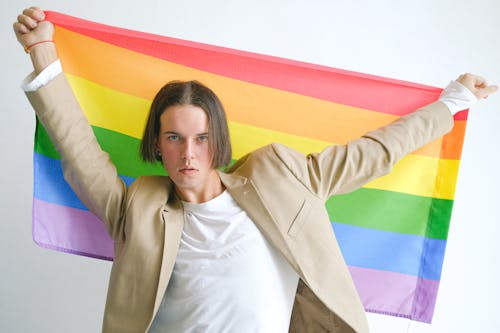 Man Holding a Gay Pride Flag