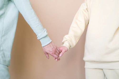 Free Close Up Shot of a Holding Hands Stock Photo
