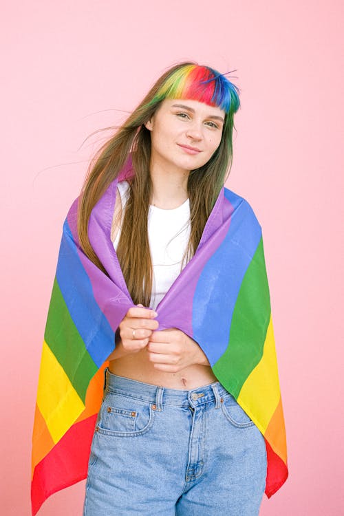 Free Woman Holding a Gay Pride Flag Stock Photo