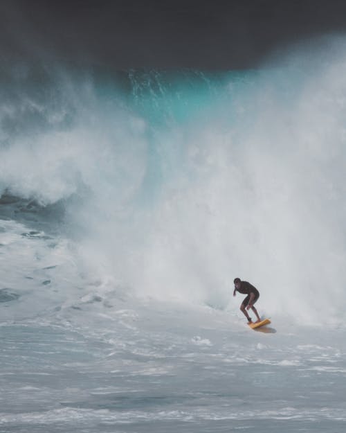 Man Surfing on Sea Waves