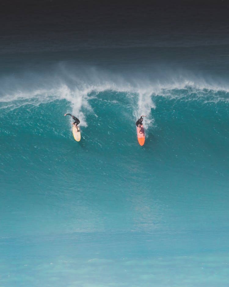 Person Surfing On Sea Waves