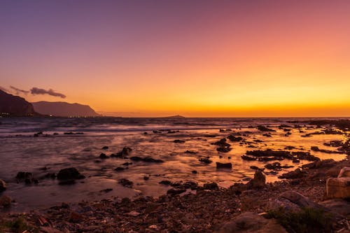 Immagine gratuita di acqua, alba, cielo arancione