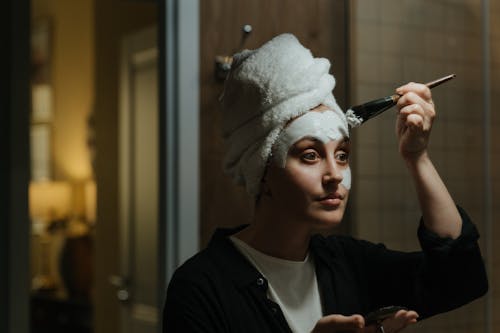 Free Woman in Black Shirt With White Towel on Head Stock Photo