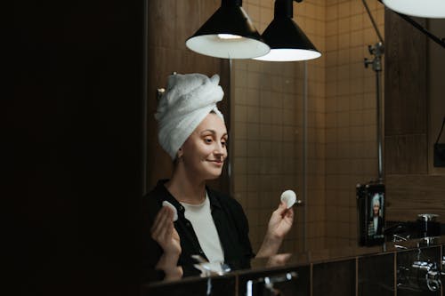 Woman in Black Shirt Wearing White Knit Cap