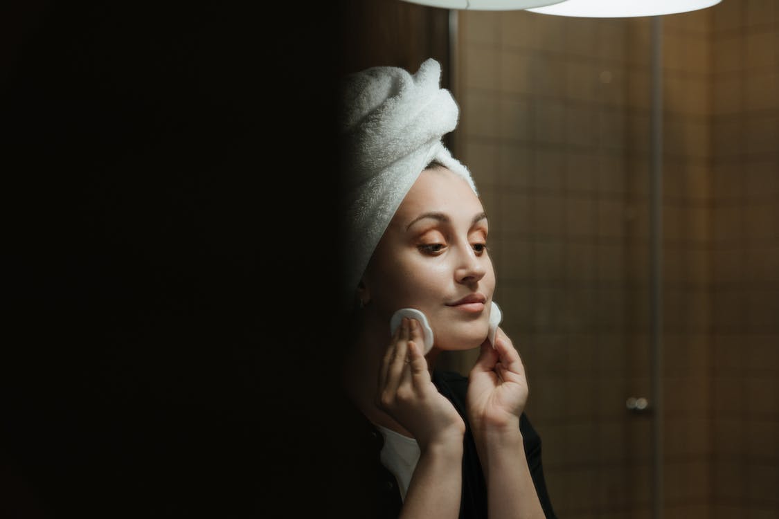 Woman in White Towel Covering Her Face