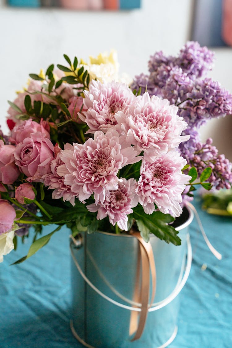 Bunch Of Flowers In A Metal Bucket
