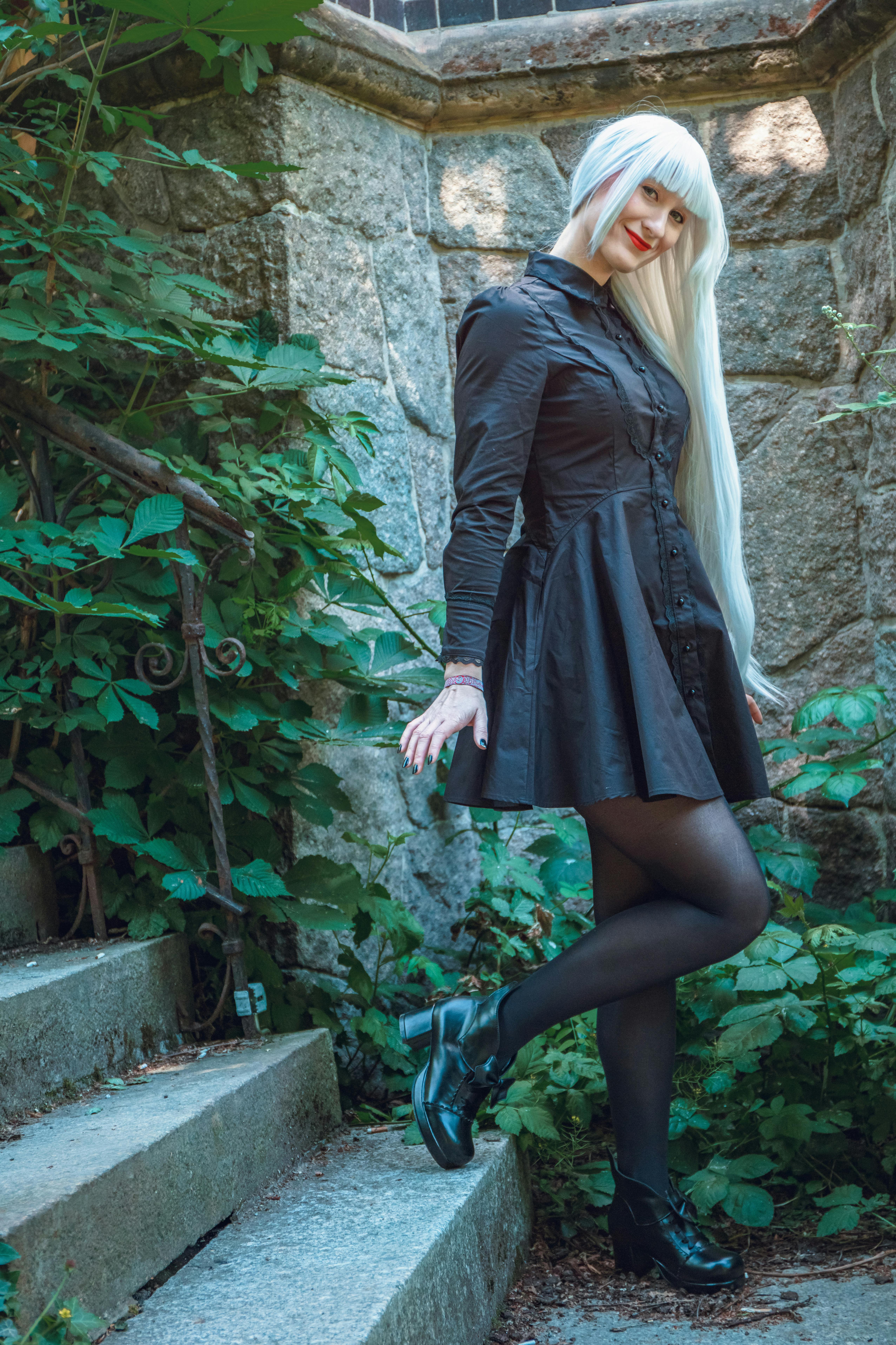 Woman in Red Hair and Black Dress
