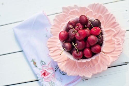 Red Fruits on White Bowl