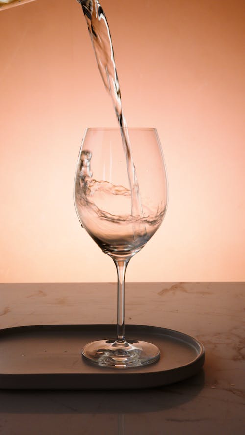 Free Clear Wine Glass on Brown Wooden Table Stock Photo