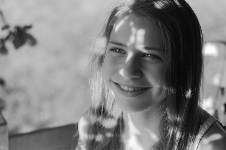 Smiling Young Girl With Shadow On Face