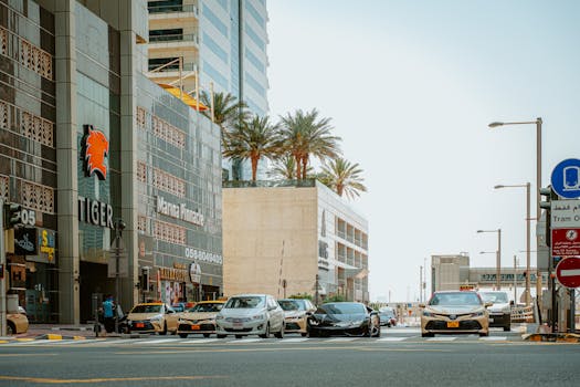 View of a busy street in Dubai's Marina District featuring modern architecture and vibrant traffic.