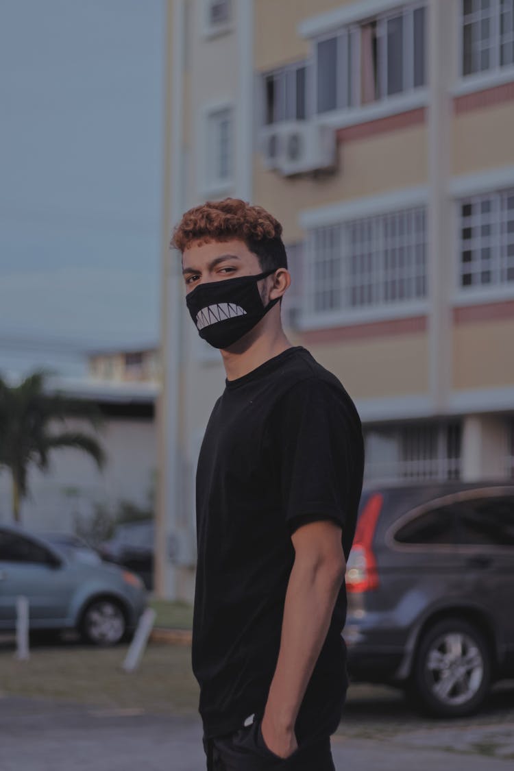 Young Man In Mask On Street