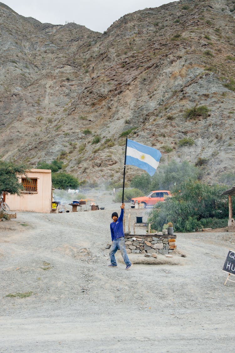 A Man Waving The Argentinian Flag