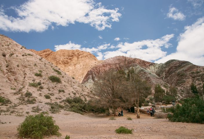 Scenic landscape of colorful hills in Purmamarca, Argentina with clear blue skies.