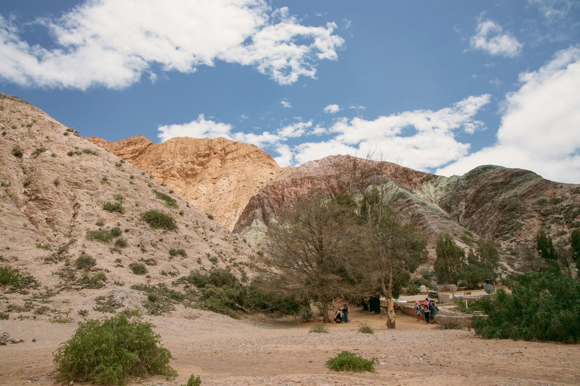 Scenic landscape of colorful hills in Purmamarca, Argentina with clear blue skies.