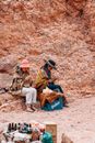 Women Sitting on Rock