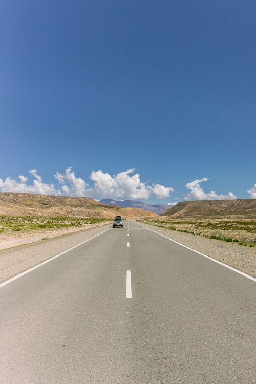 Free Open road under clear blue skies in Argentina's scenic landscape, perfect for travel inspiration. Stock Photo