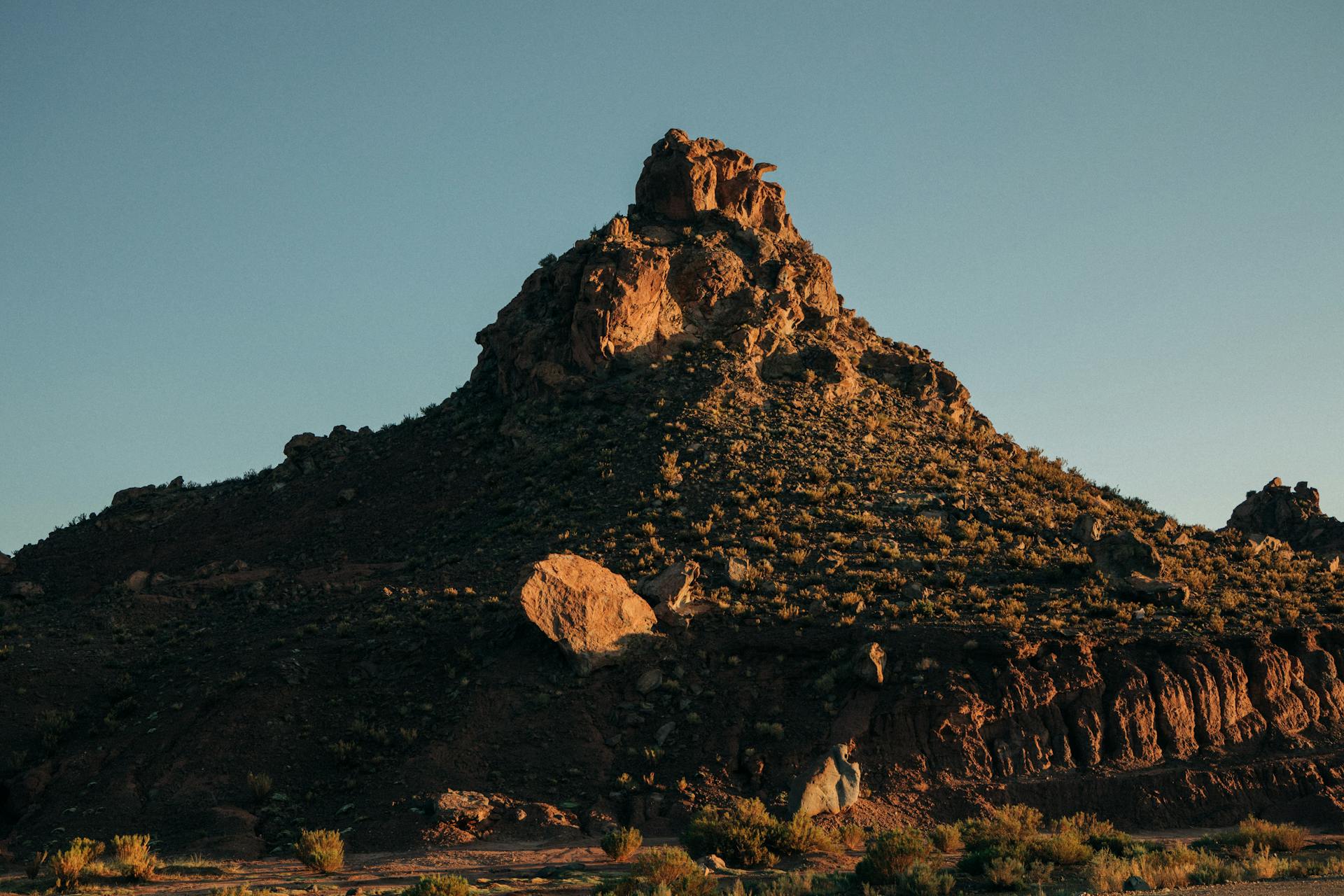 Dramatic rock formation in Susques, Jujuy, Argentina at sunset showcasing rugged natural beauty.