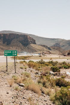 Discover the rugged beauty of Jujuy's landscapes with a road sign pointing to Huancar and Sey.