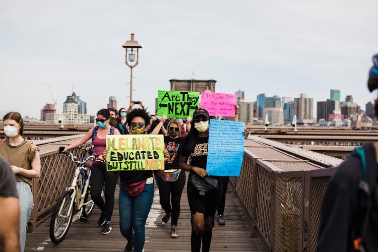 Protesters Holding Signs