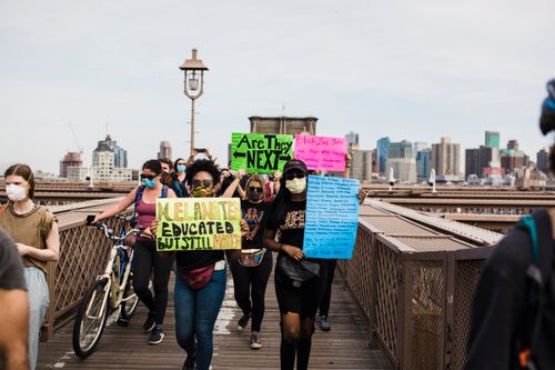 Free A diverse protest on Brooklyn Bridge advocating social justice and equality. Stock Photo