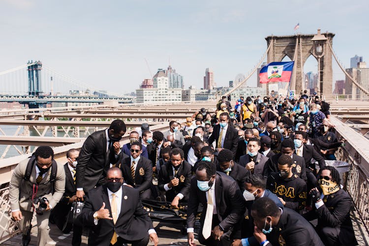 Crowd Of Protesters Kneeling