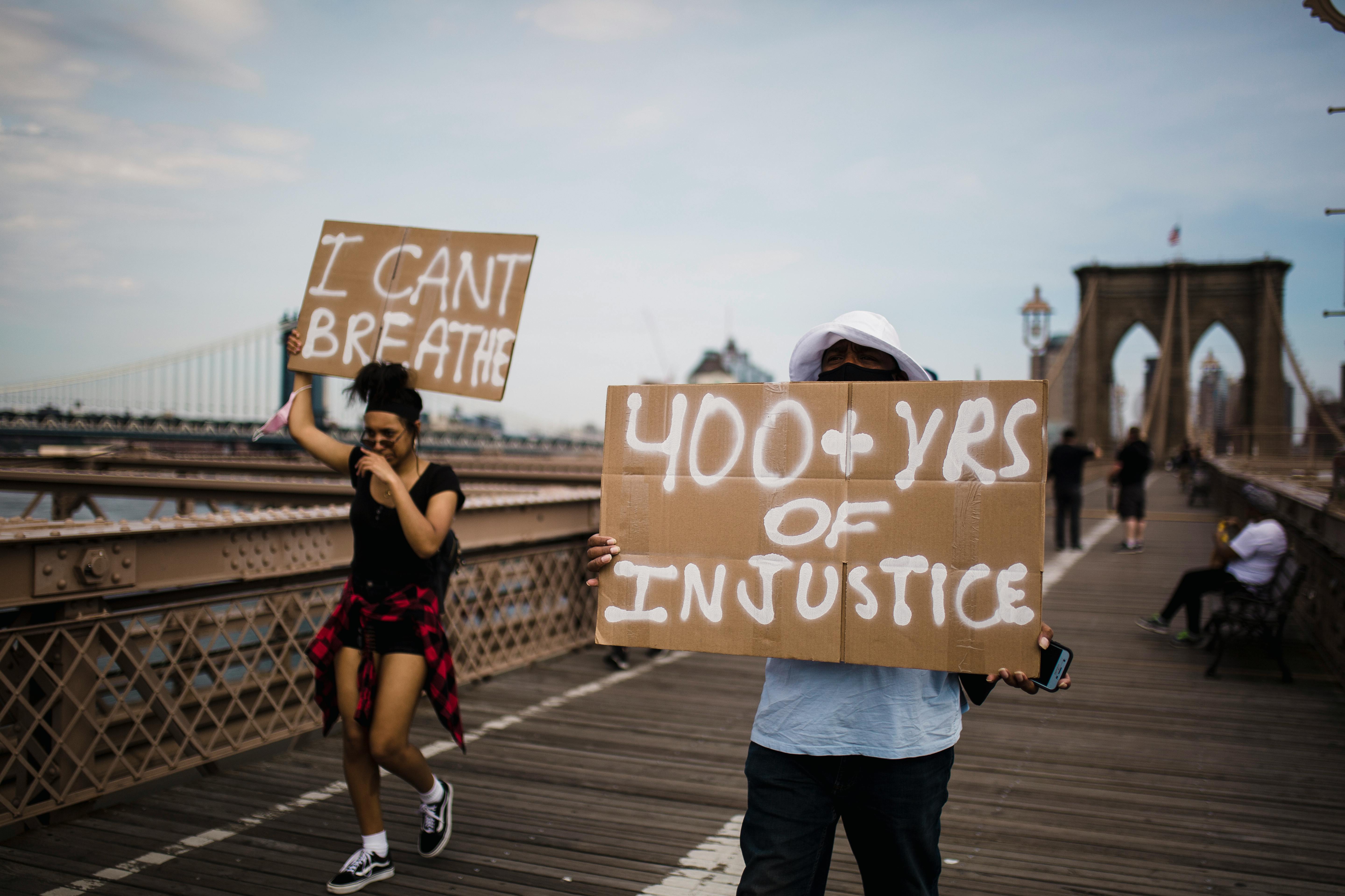 protesters holding signs