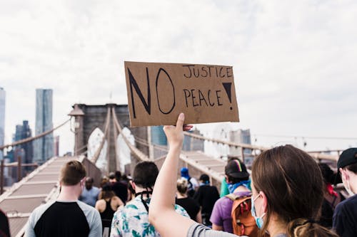 Protester Holding a Sign