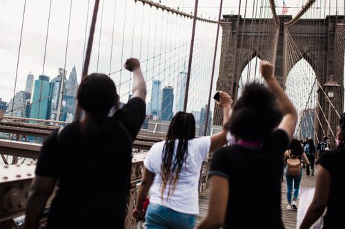 Free A powerful protest on the Brooklyn Bridge in New York City, symbolizing justice and solidarity. Stock Photo