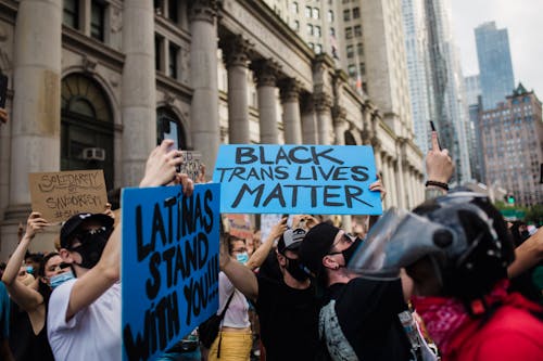 Crowd of Protesters Holding Signs