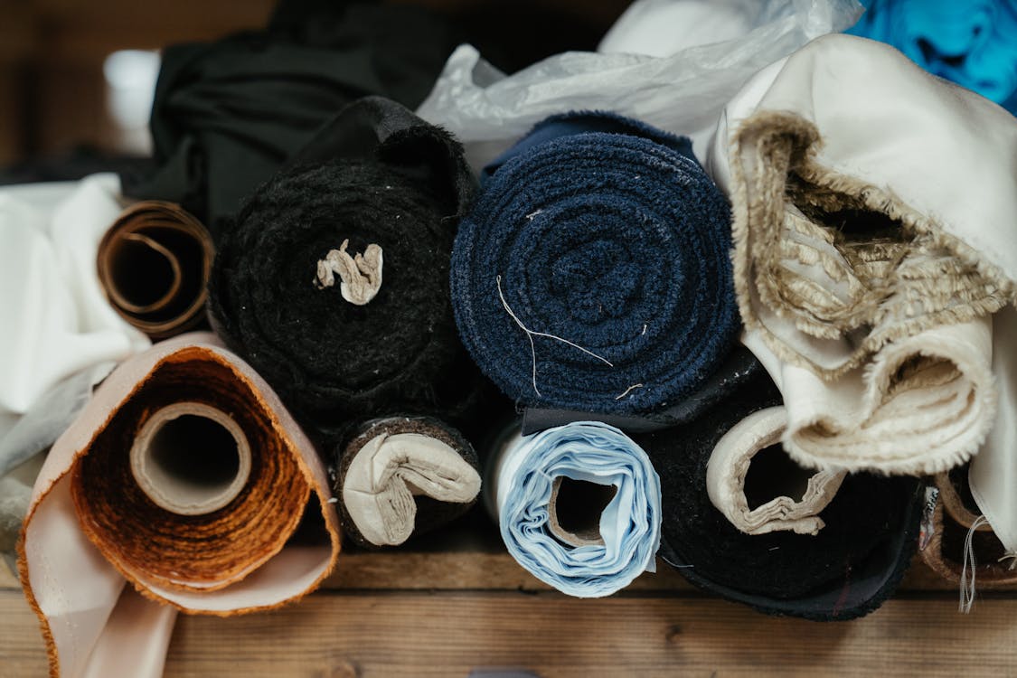 Free Blue Yarn on Brown Wooden Table Stock Photo