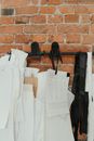Black Sling Bag on White Paper