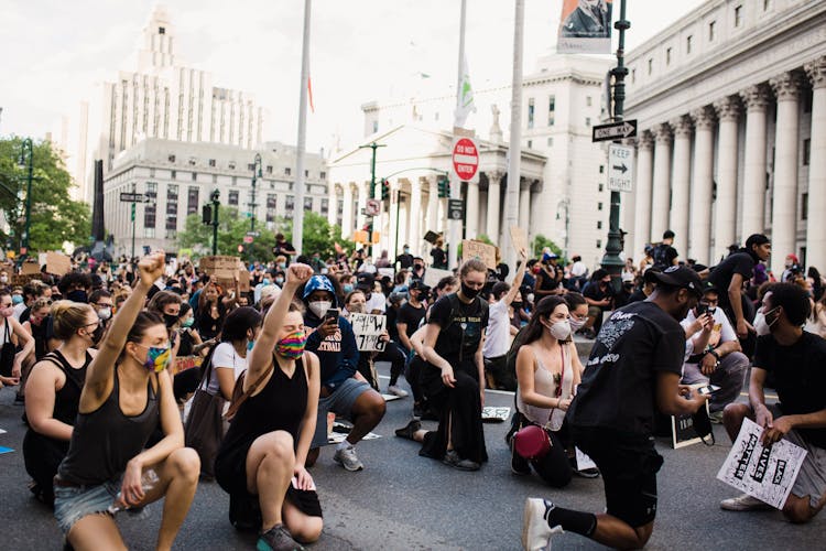 Crowd Of Protesters Kneeling