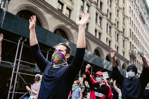 Protesters With Arms Raised