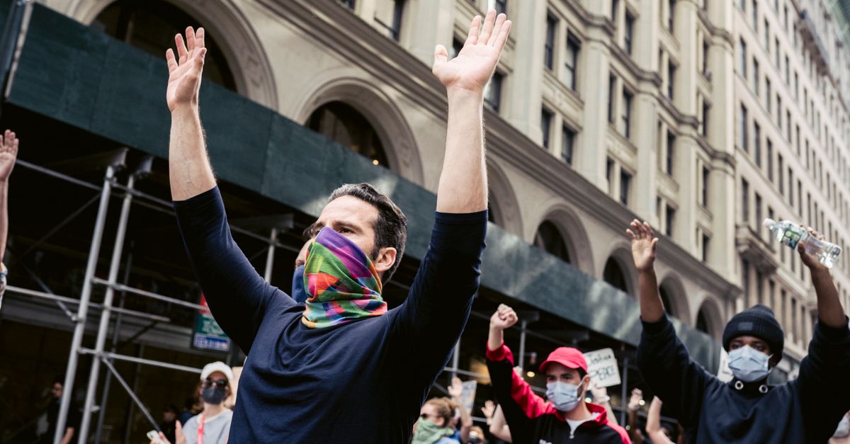 Protesters With Arms Raised · Free Stock Photo