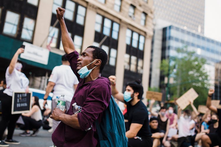 Man With Raised Fist In A Protest