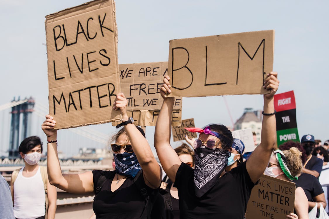 Free People Protesting and Holding Signs Stock Photo