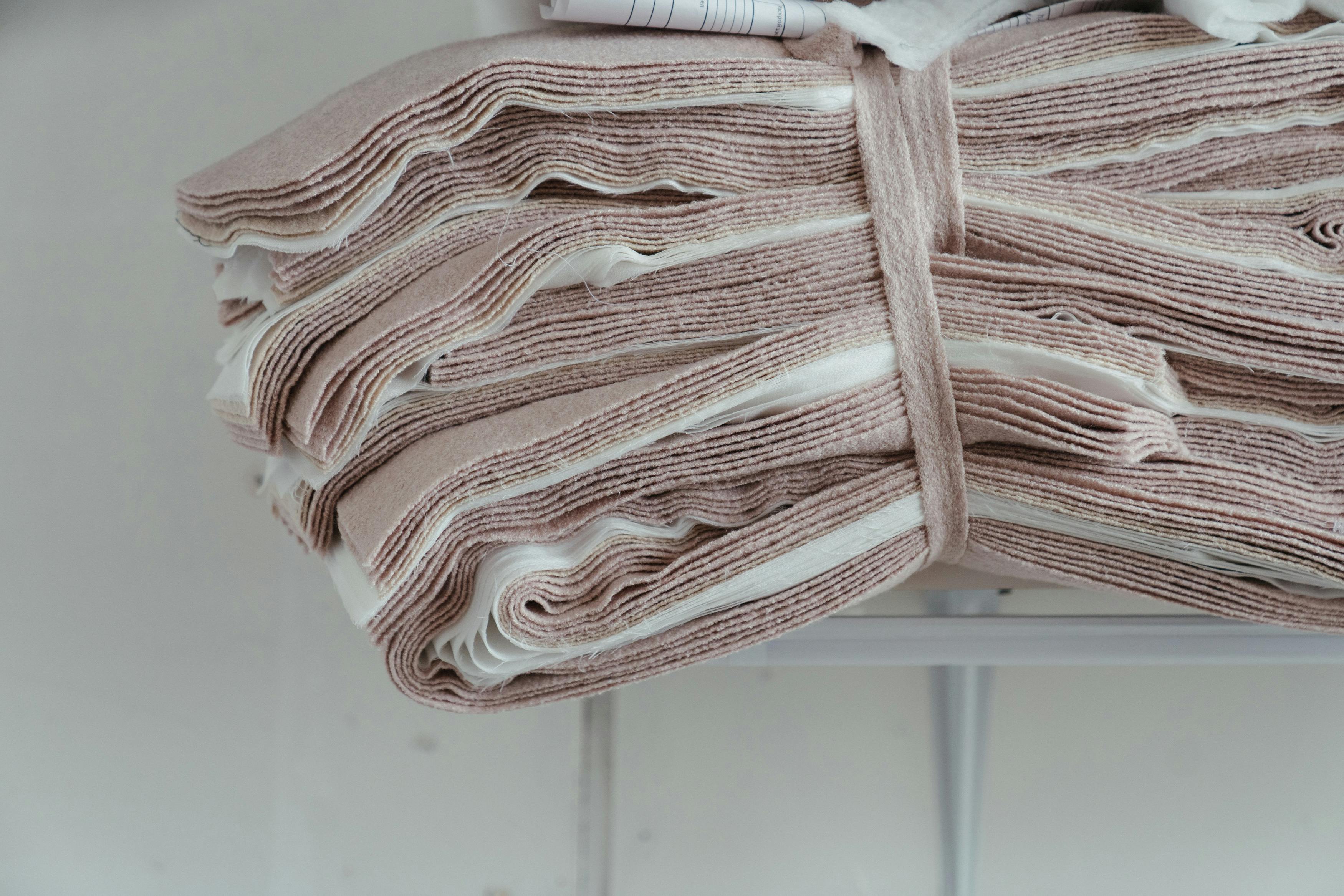 white and pink striped textile