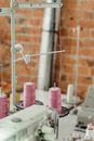 Pink Pillar Candles on White Metal Rack