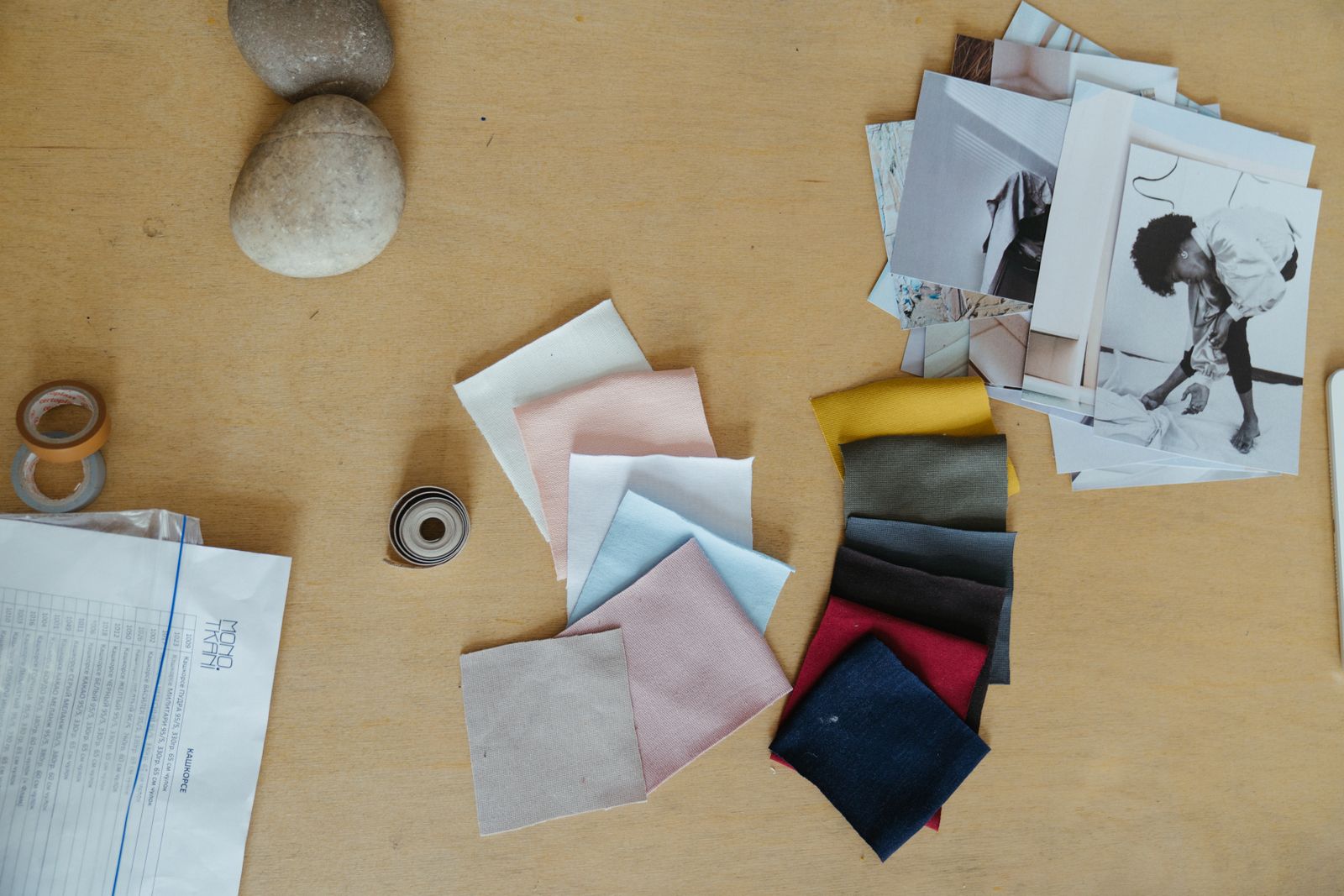 Quality inspector checking fabric rolls and garment stitching in a textile factory