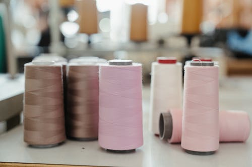 Free Pink Thread on White Table Stock Photo
